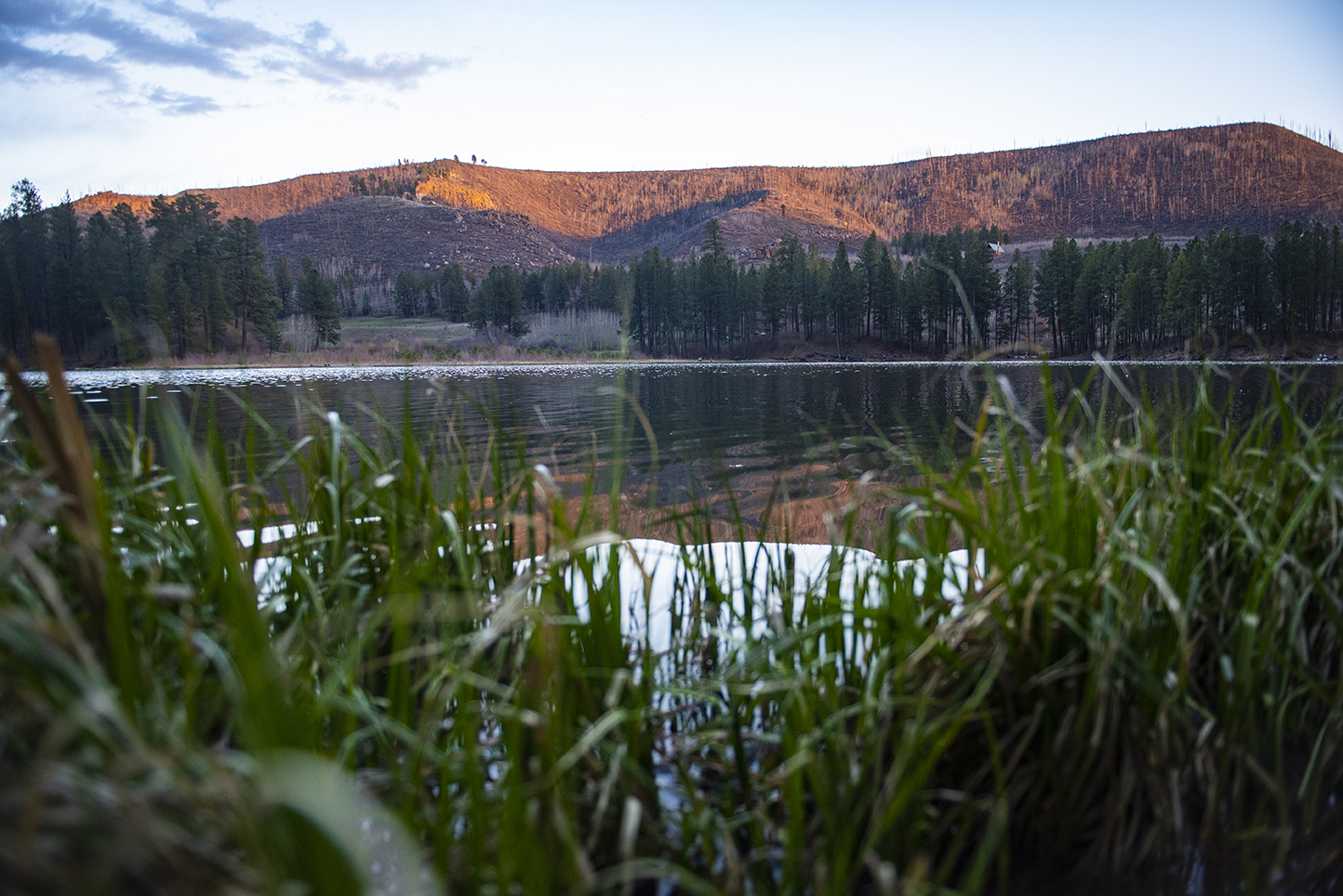 photo: a body of water with mountains behind it